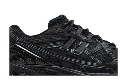 1906U Triple Black VOSneakers
